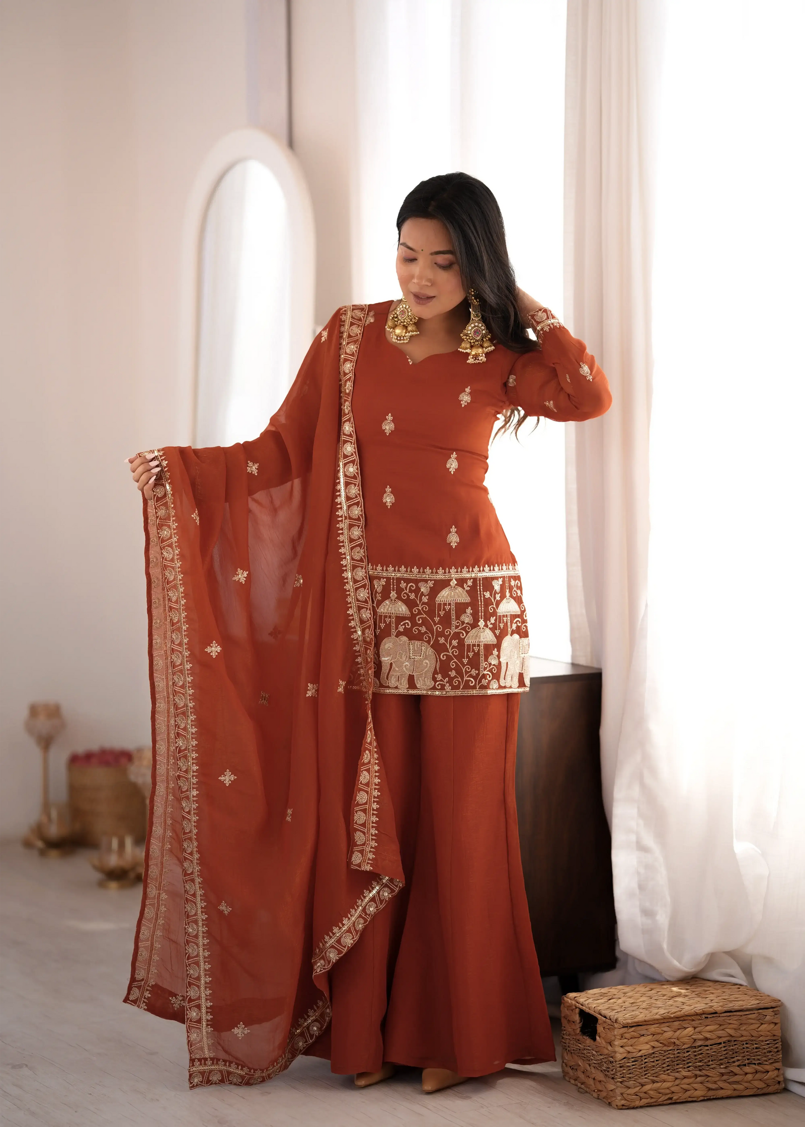 Light Orange Suit Showing Elephant Embroidery Border – Front Detail View