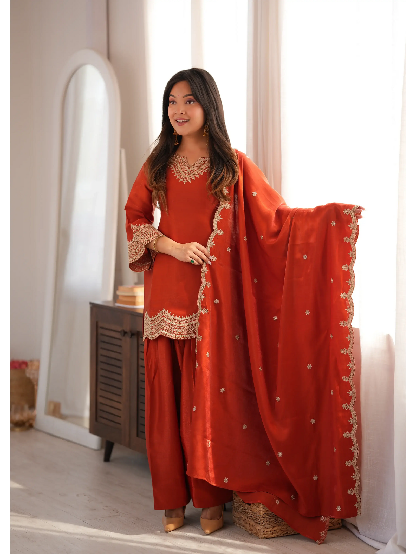 Light Orange Sequins Suit styled with dupatta drape