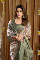 Woman in a floral saree with a decorative background