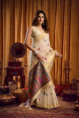 Woman in a traditional saree with a vintage gramophone in an ornate room.