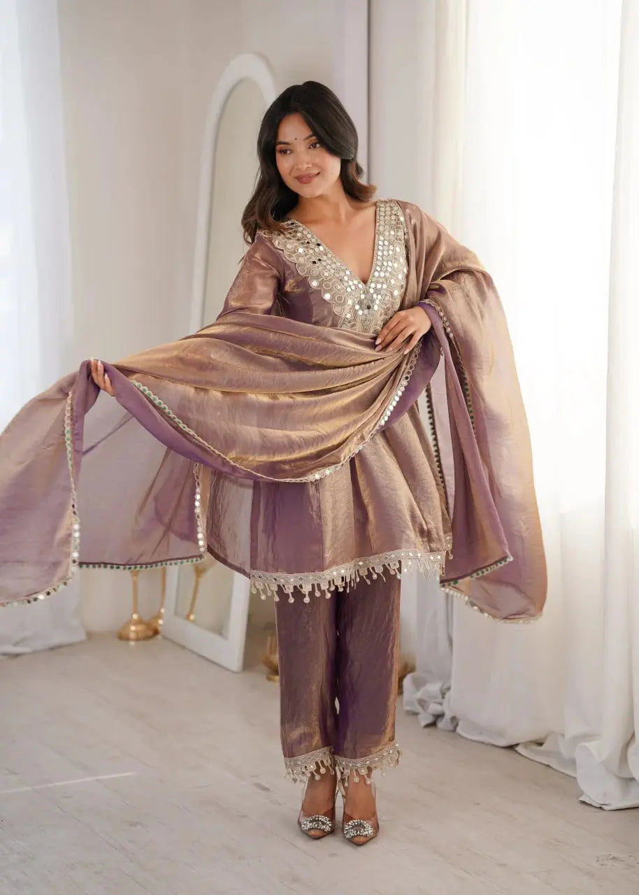 Woman in a traditional outfit with a shawl in a bright room