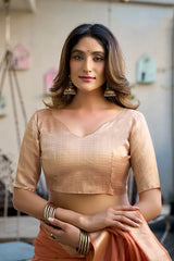 Woman wearing a traditional outfit with a blurred background