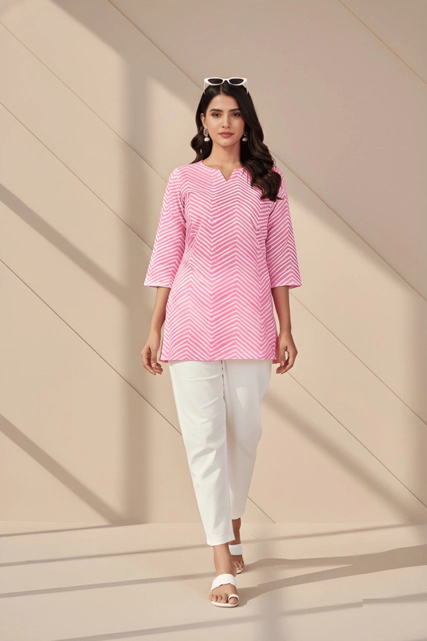 Light pink cotton blend short kurti with elegant digital print displayed on mannequin.
