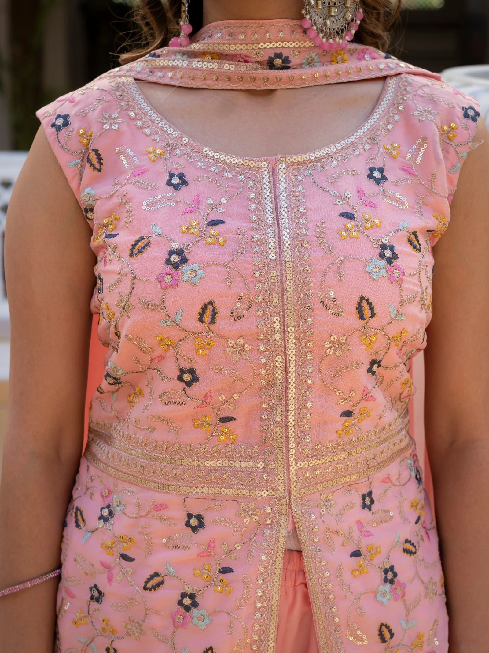 Elegant party wear light pink embroidered georgette suit.