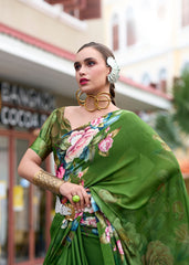 Woman wearing a green saree with floral patterns in an urban setting