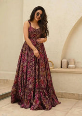 Woman wearing a patterned dress in an indoor setting