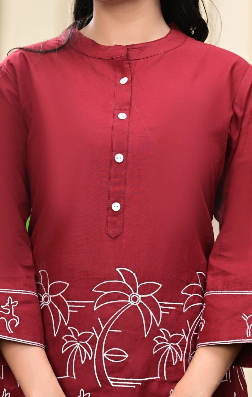 Maroon kurta with white floral embroidery on a plain background