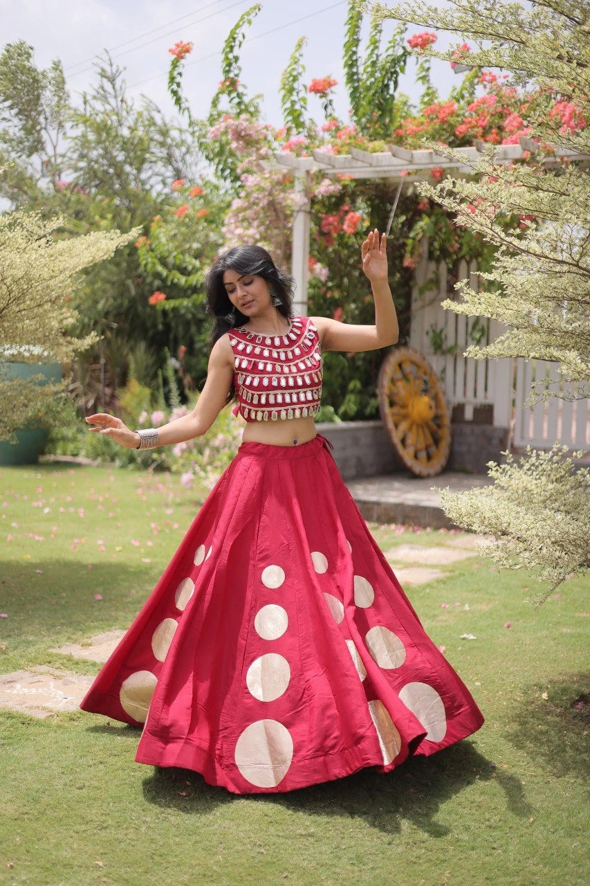 Stylish ethnic outfit combining a contemporary mirror work blouse with a graceful full-flare designer skirt.