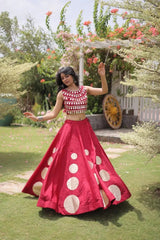 Stylish ethnic outfit combining a contemporary mirror work blouse with a graceful full-flare designer skirt.