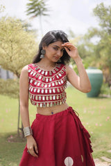 Stunning pink lehenga with oversized gold foil polka dots and a heavily embellished mirror work blouse for a luxurious festive appearance.
