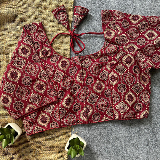 Traditional maroon saree blouse.
