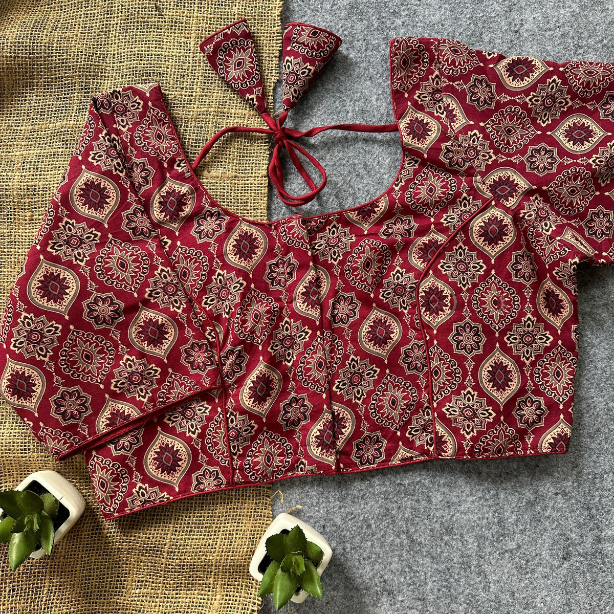 Traditional maroon saree blouse.