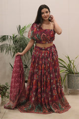 Woman wearing a patterned outfit with plants in the background
