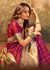 Woman in a traditional saree with a gold and purple color scheme against a textured background
