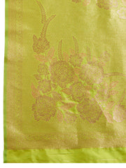 Green fabric with intricate gold embroidery on a matching green background
