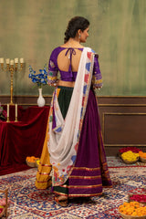 Back view of multicolor lehenga showing U-back tie-up choli and Kutchi printed dupatta draped
