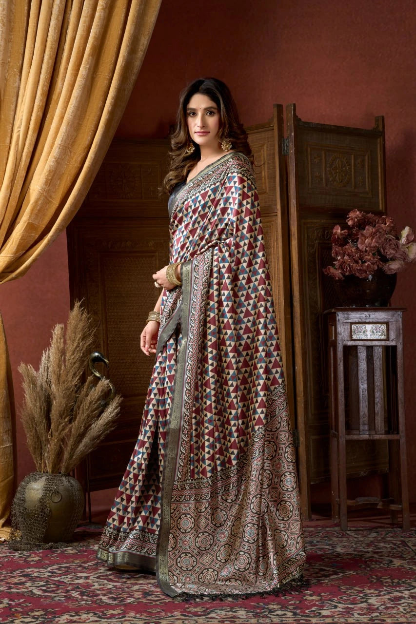 Woman in a patterned dress standing in a room with decorative elements.
