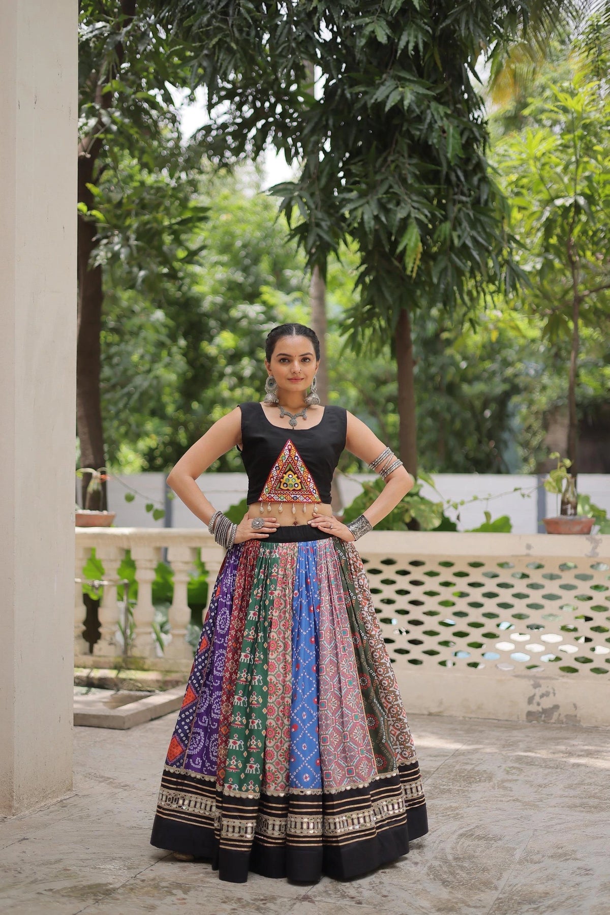 Vibrant multicolor cotton lehenga with digital print, embellished with gota patti and mirror lace work.