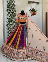 Colorful traditional outfit with a mannequin against a neutral wall.
