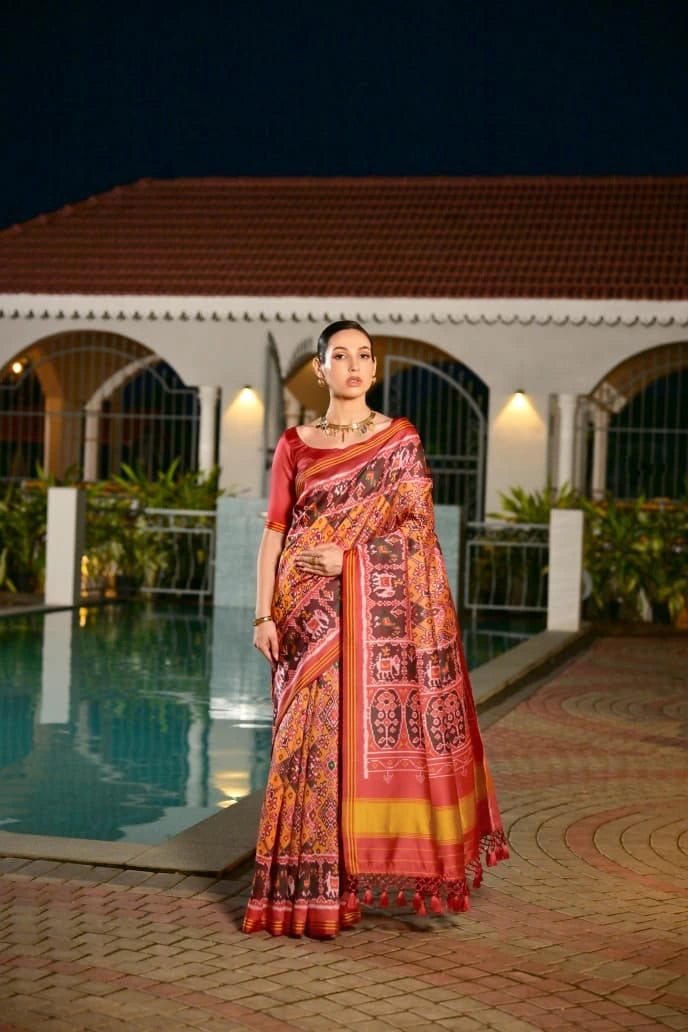 Mustard yellow Patola silk saree with traditional Ikkat print displayed on Shopify product page