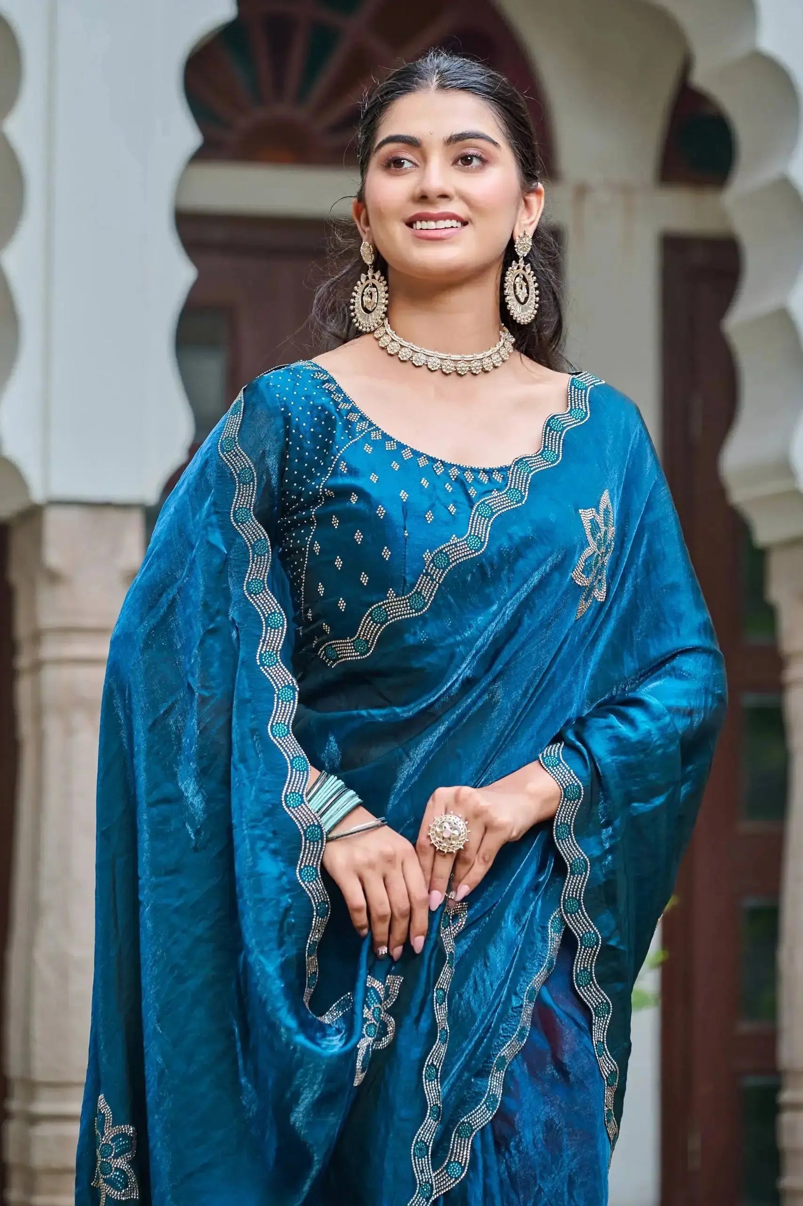 Close-up of Navy Blue Diamond Work Saree blouse and pallu with teal stone contrast border