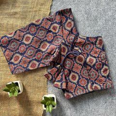 Green plants frame the garment beautifully.