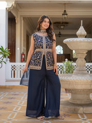 Detailed embroidery patterns on navy blue georgette suit fabric.