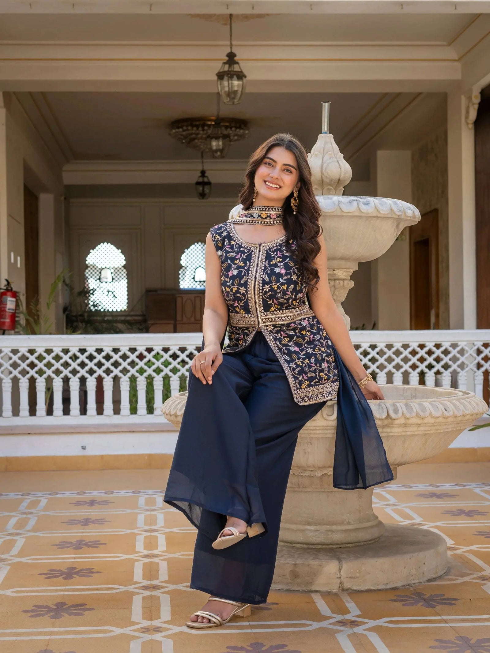Elegant party wear navy blue embroidered georgette suit.