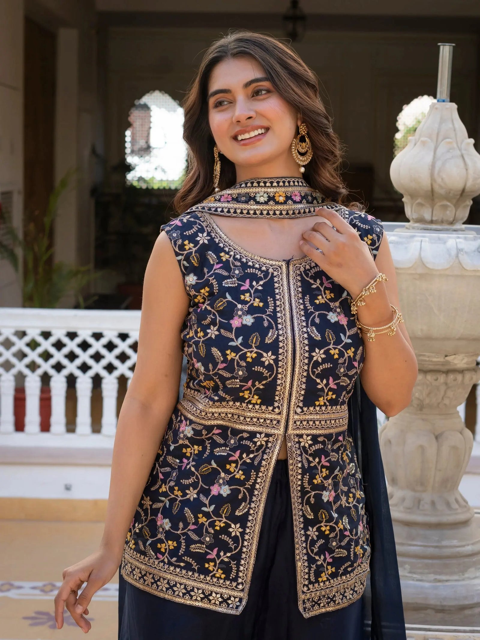 Traditional navy blue georgette suit with rich embroidery work.