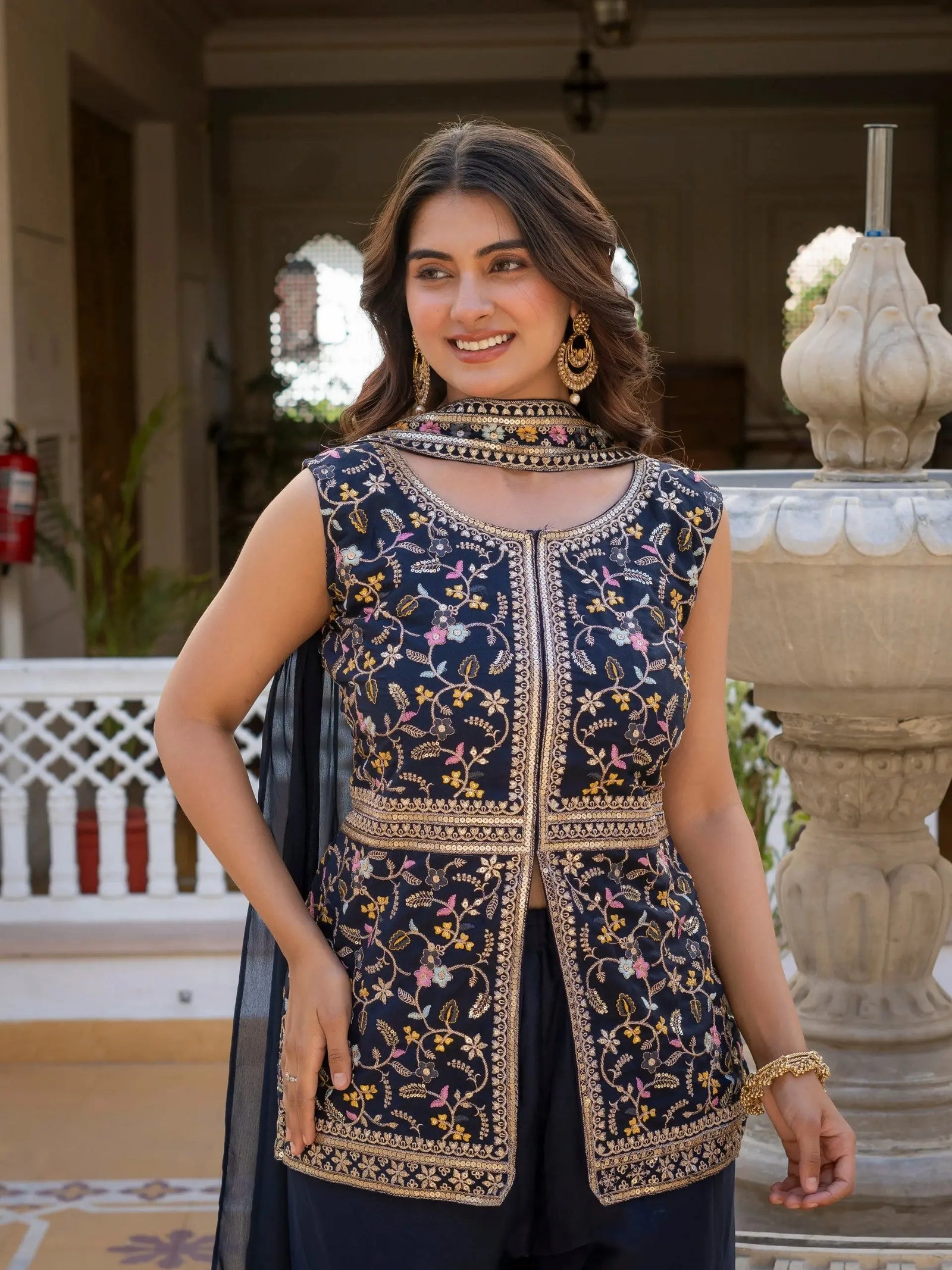 Heavy embroidered navy blue georgette suit styled for festive wear.