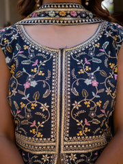 Navy blue georgette suit with intricate embroidery across bodice and sleeves.