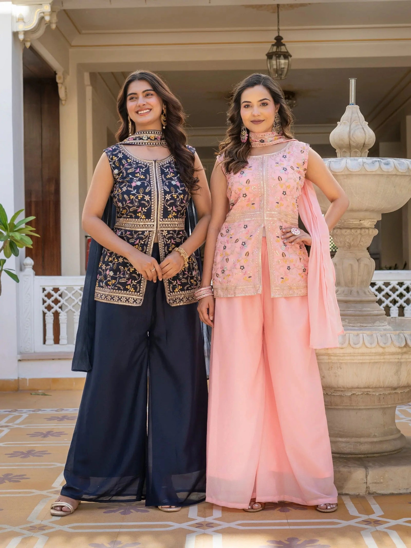Elegant navy blue embroidered georgette suit with shimmering accents.