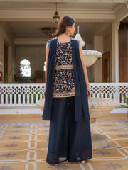 Navy blue star georgette suit with shimmering embroidery accents.