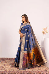 Woman wearing a blue saree with a white background