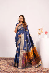 Woman wearing a blue saree with a gold border and a black panther design on a white background