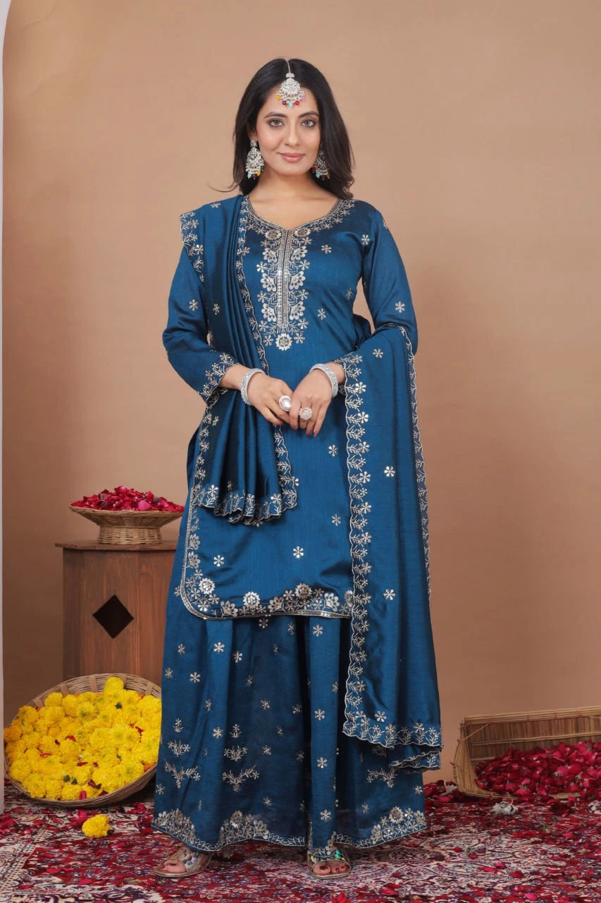 Woman in a blue traditional outfit with floral decorations on a beige background
