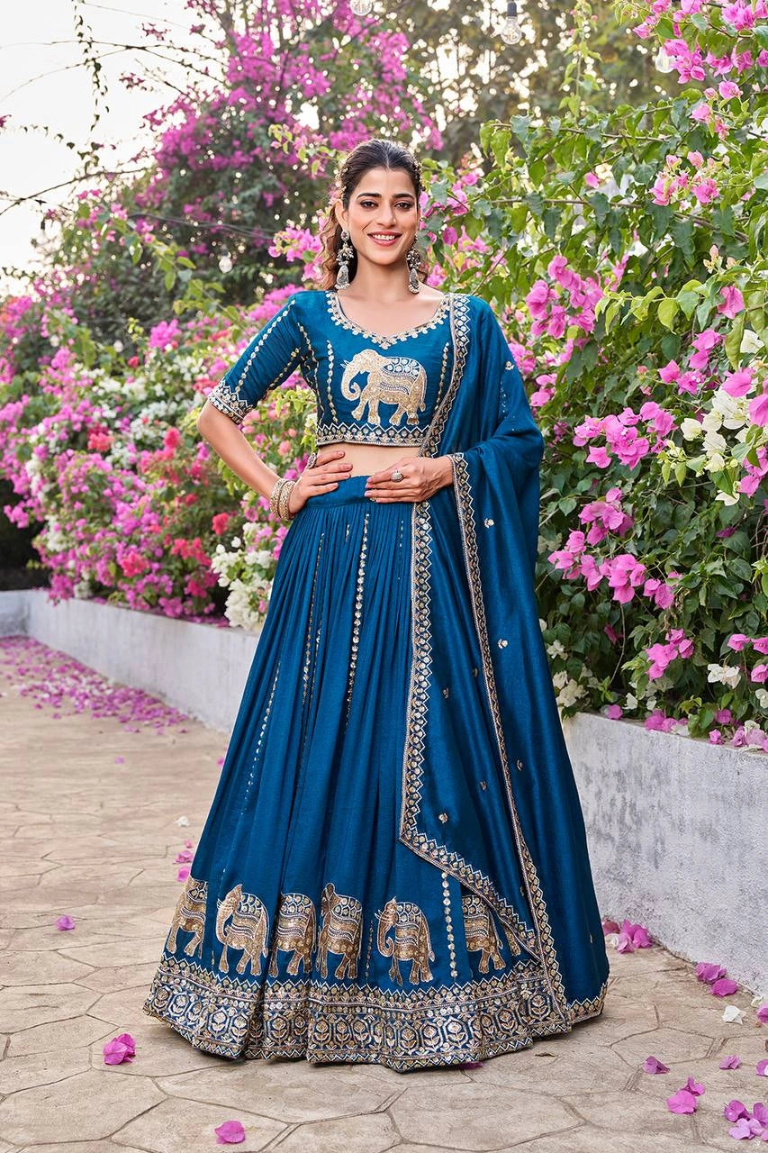 Navy blue lehenga with sequins embroidery and moti work displayed on mannequin.