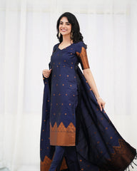 Woman wearing a navy blue traditional outfit with brown patterns against a white background