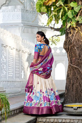 Designer ethnic lehenga featuring artistic floral motifs, zari borders, and tassel detailed dupatta for a graceful traditional look.