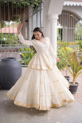 Festive Wear Cream White Lehenga Set featuring Full Sleeve Blouse, Layered Skirt, and Elegant Gota Border