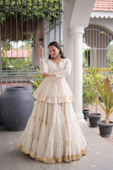 Beautiful Cream White Ethnic Lehenga with Full Sleeves, Tiered Ghera, and Subtle Gota Patti Accents