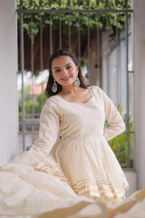 Designer Off White Lehenga Choli featuring Layered Flared Skirt, Peplum Style Top, and Golden Border Detailing