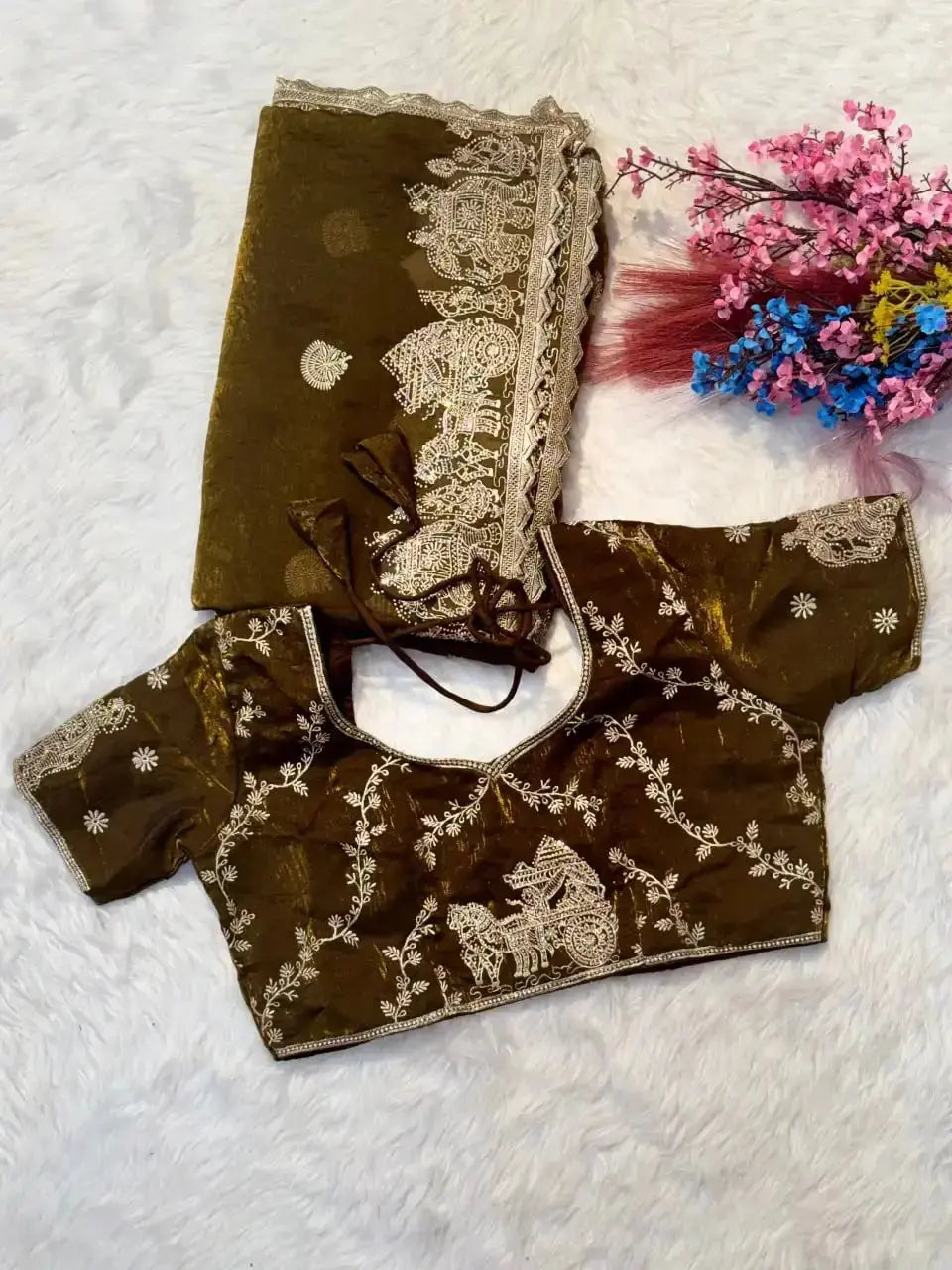 Olive Green Zari Embroidered Saree flat lay with matching blouse piece