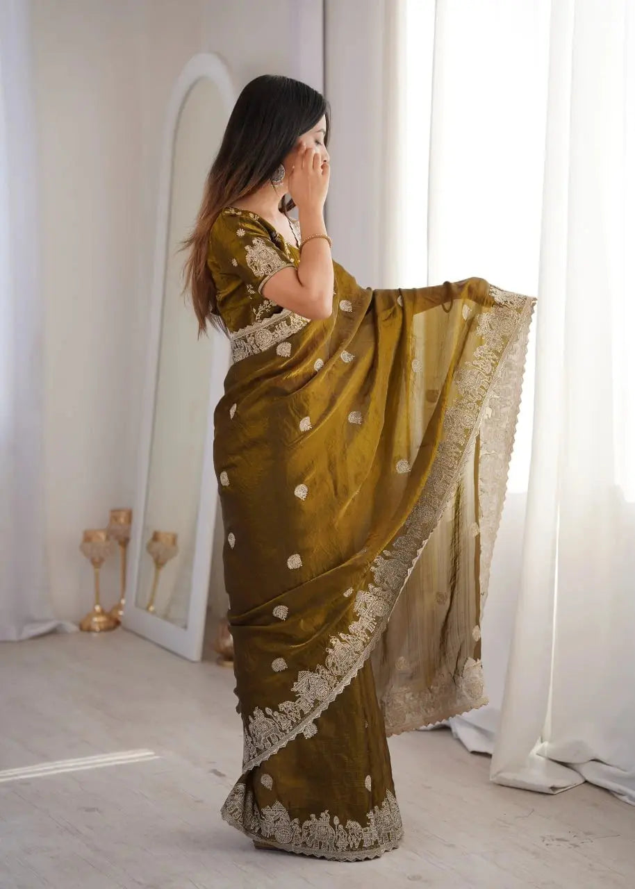 Olive Green Zari Embroidered Saree side profile view holding pallu near face