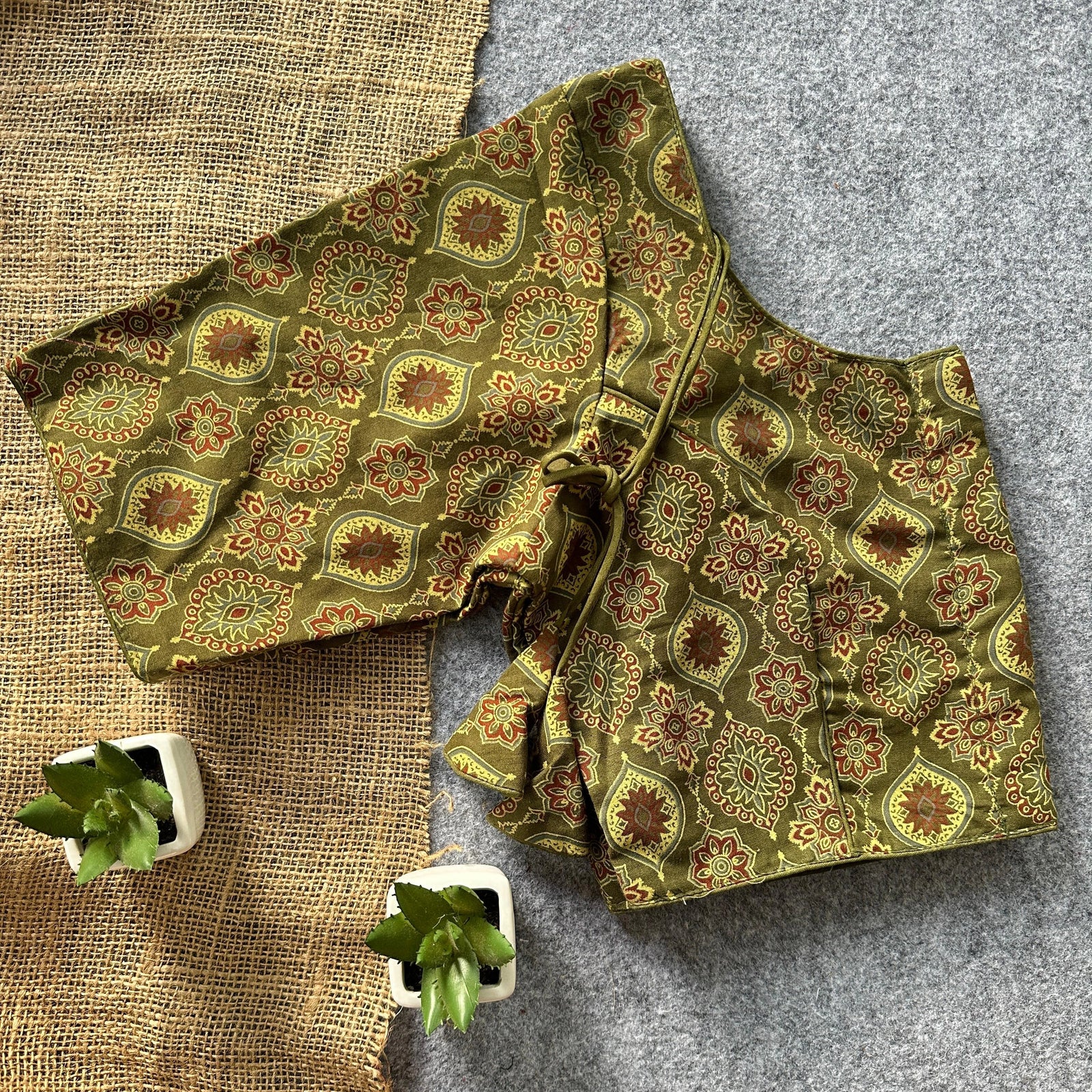 Festive cotton blouse with elbow-length sleeves and open back design