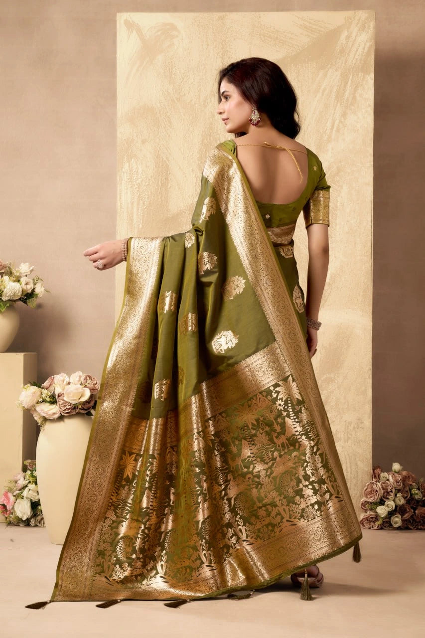Woman wearing a green and gold traditional outfit with a floral background