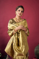 Woman wearing a gold traditional outfit against a pink background
