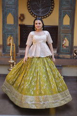 Woman wearing a traditional outfit with a white top and green skirt in an ornate setting.