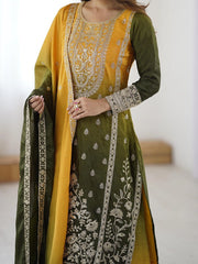 Green and yellow embroidered traditional outfit with a plain background