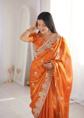 Close-up of Orange Zari Embroidered Saree pallu and blouse